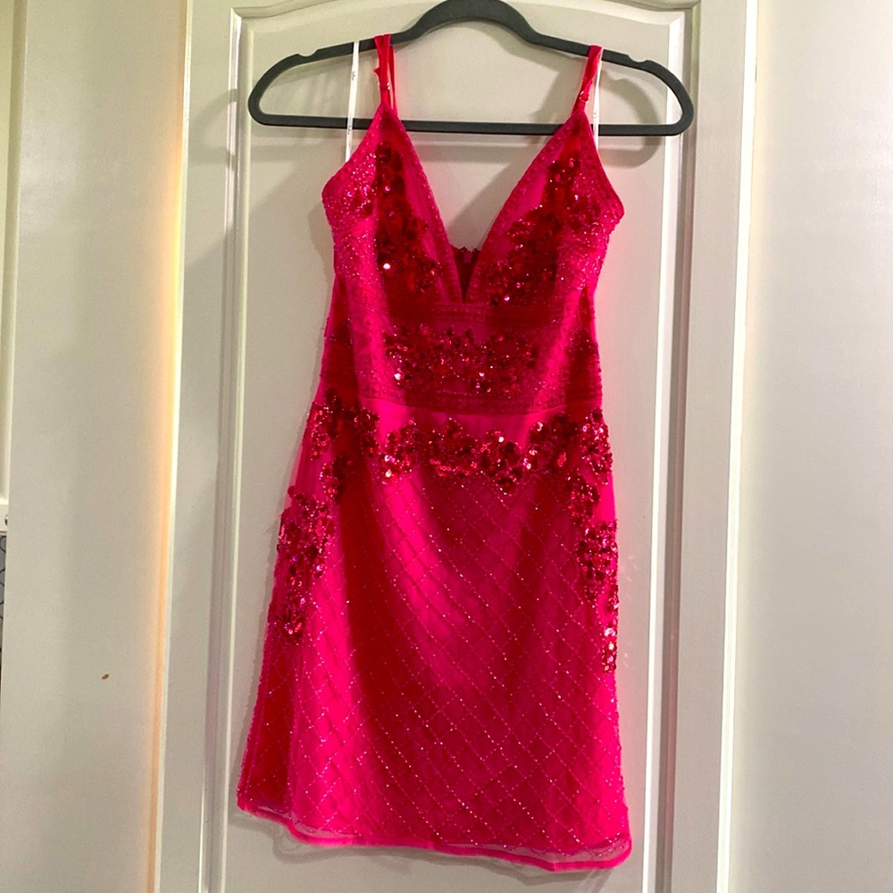 Worn once, Lulu’s pink, sequin dress.